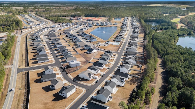 bird's eye view with a water view and a residential view