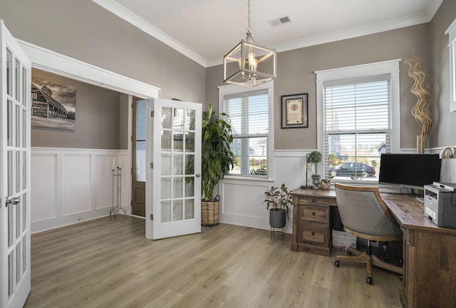 home office featuring light wood finished floors, visible vents, crown molding, french doors, and a notable chandelier