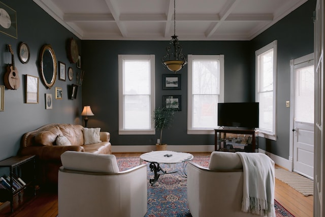 living room featuring baseboards, coffered ceiling, beamed ceiling, and wood-type flooring