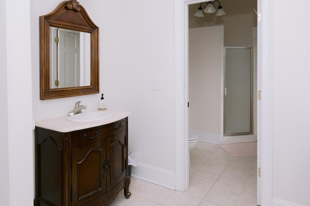 full bath featuring baseboards, a stall shower, toilet, and vanity