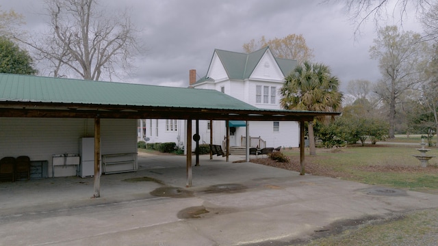 view of parking / parking lot with a carport