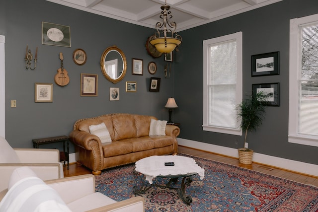 living room featuring beamed ceiling, coffered ceiling, wood finished floors, and baseboards