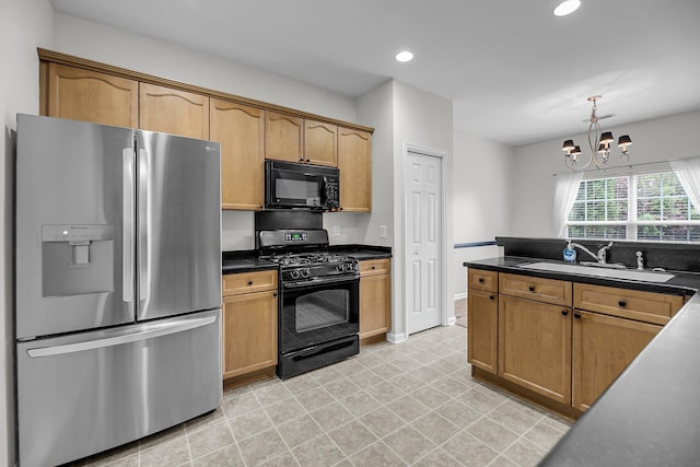 kitchen featuring black appliances, a sink, dark countertops, a chandelier, and recessed lighting