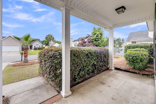view of patio / terrace with a residential view and fence