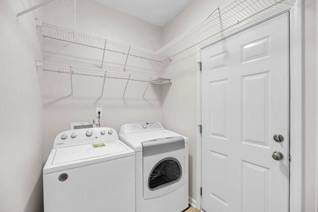 laundry room with washing machine and clothes dryer