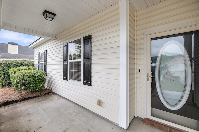 entrance to property with a patio area