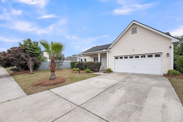ranch-style home featuring driveway and a garage