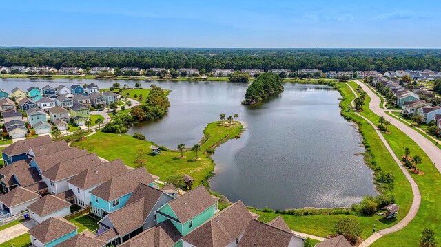 aerial view of residential area featuring a nearby body of water