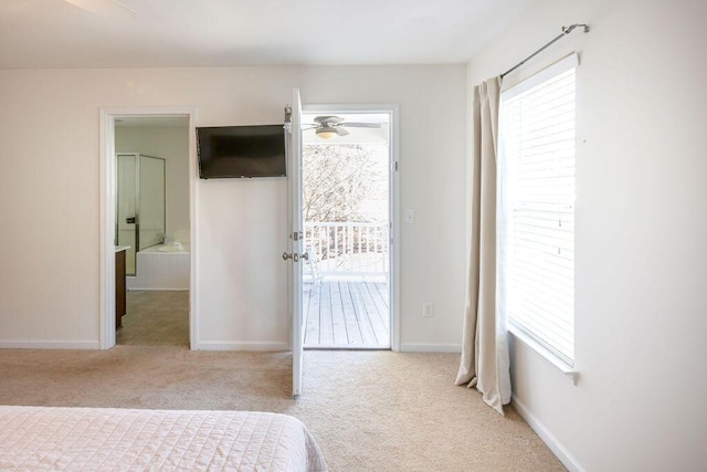 carpeted bedroom with baseboards, multiple windows, and access to exterior