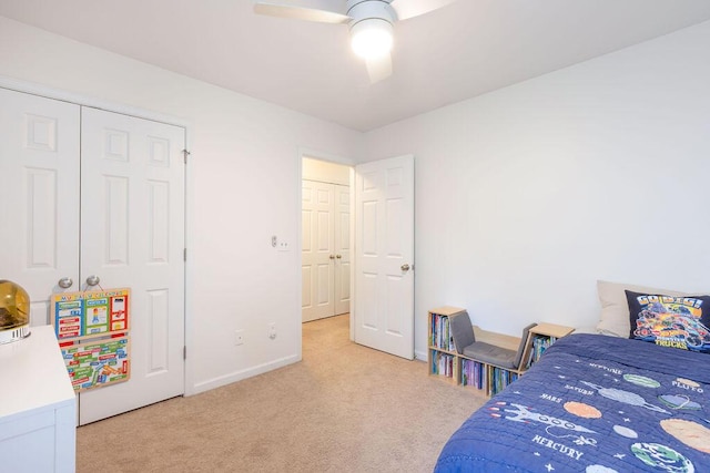 carpeted bedroom featuring ceiling fan and baseboards