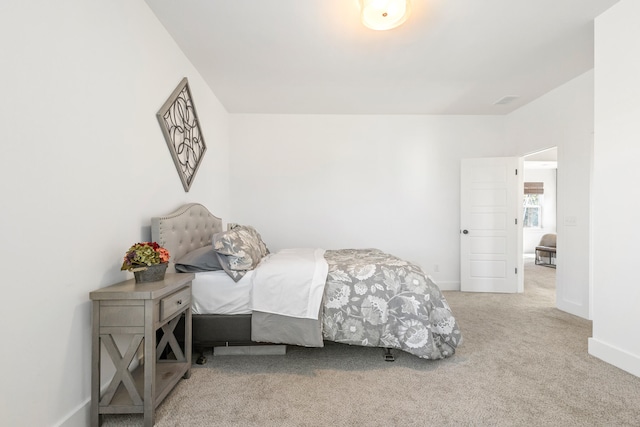 bedroom with light colored carpet