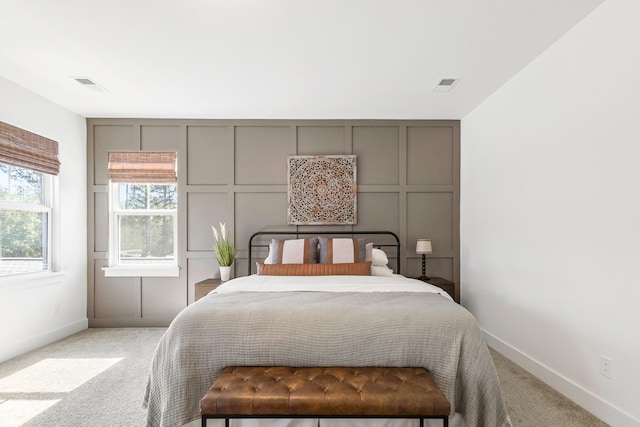 bedroom with light colored carpet