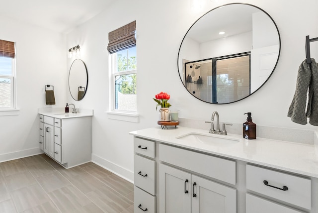 bathroom with vanity and walk in shower