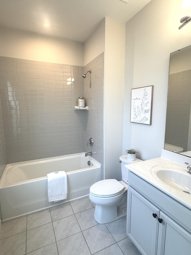 bathroom featuring toilet, tile patterned flooring, bathtub / shower combination, and vanity