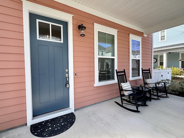 property entrance with covered porch