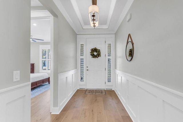 entryway with light hardwood / wood-style floors and ceiling fan