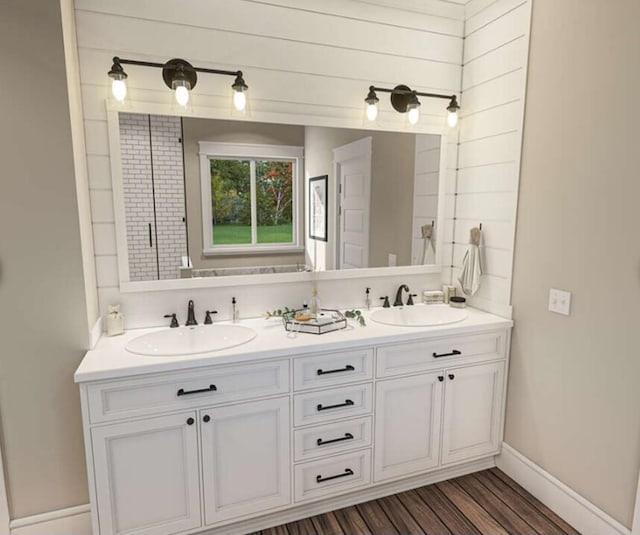 bathroom with wood-type flooring, vanity, and wood walls