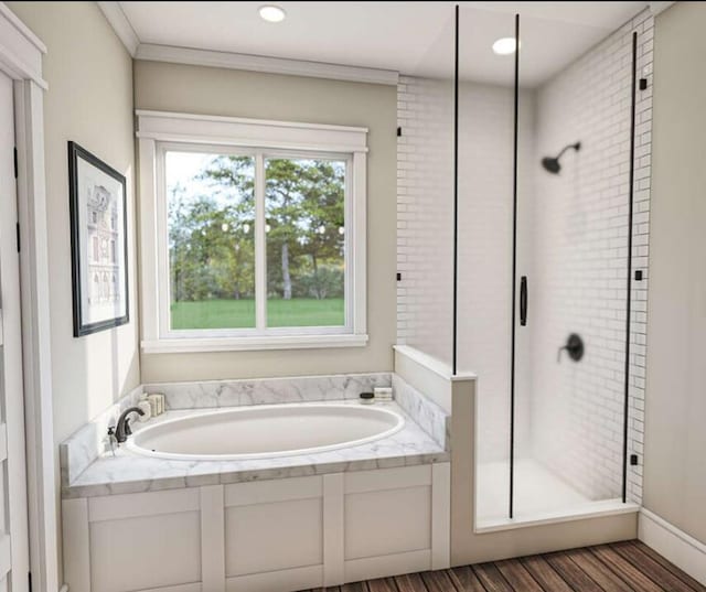 bathroom with independent shower and bath, crown molding, and hardwood / wood-style flooring