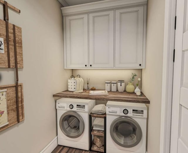 washroom featuring washing machine and dryer and cabinets