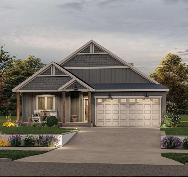 view of front of property featuring a porch and a garage