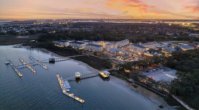 aerial view at dusk with a water view