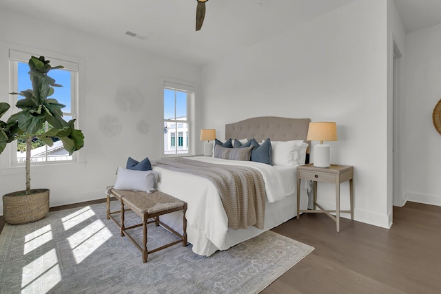 bedroom with hardwood / wood-style flooring and ceiling fan