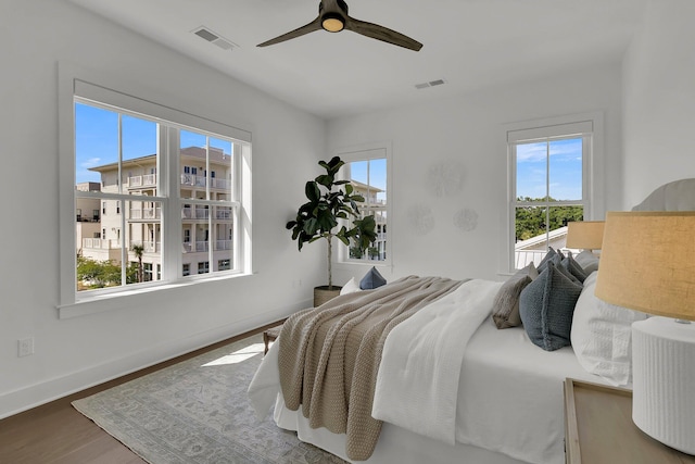 bedroom featuring ceiling fan and hardwood / wood-style floors