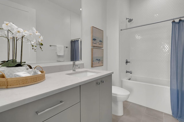 full bathroom featuring tile floors, shower / bath combo, toilet, and double sink vanity