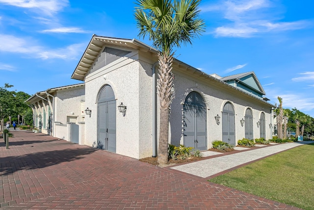 view of side of home with a garage