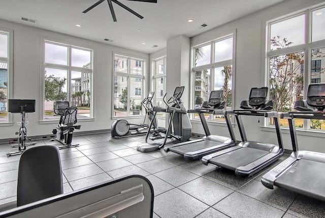 workout area featuring tile flooring and ceiling fan