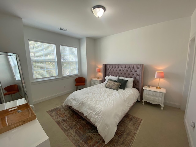 bedroom featuring carpet flooring, visible vents, and baseboards