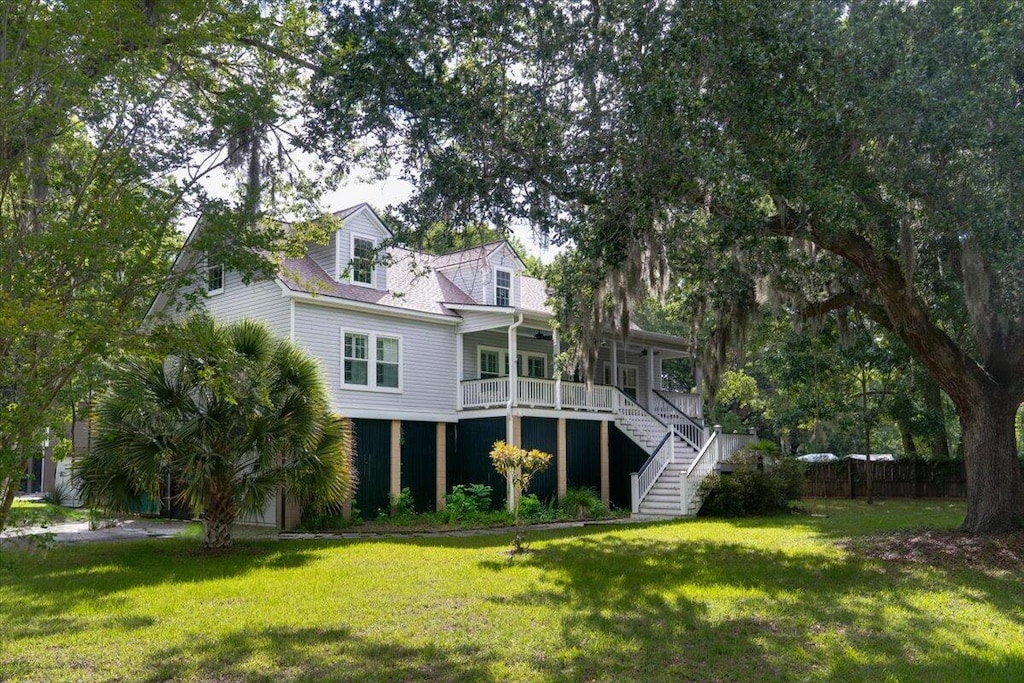 rear view of house with a yard