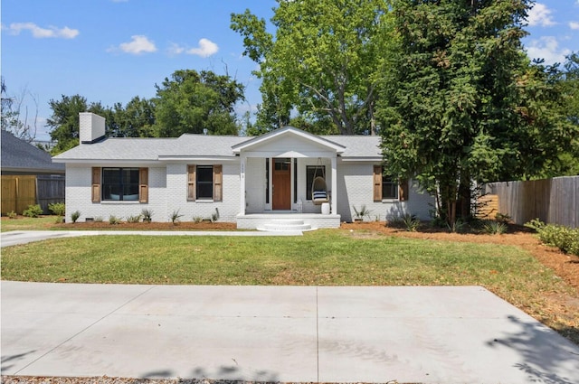 single story home featuring a front yard