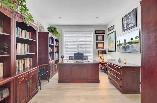 office space with light wood-type flooring