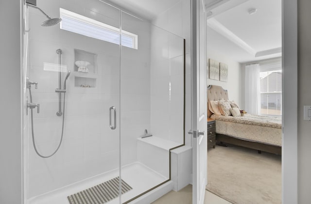 bathroom with a shower with door