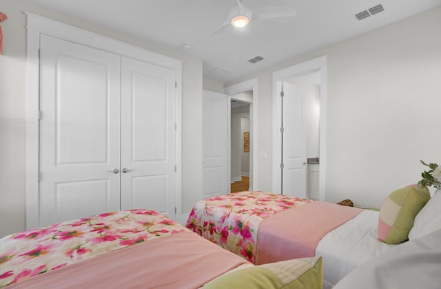 bedroom featuring ceiling fan and a closet