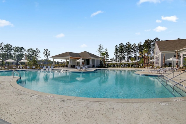 view of swimming pool with a patio area