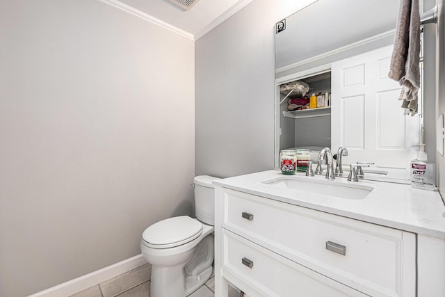 half bath featuring vanity, toilet, crown molding, and baseboards