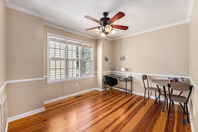 interior space featuring hardwood / wood-style flooring, crown molding, baseboards, and ceiling fan