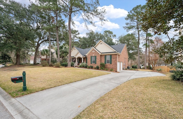view of front of property with driveway and brick siding