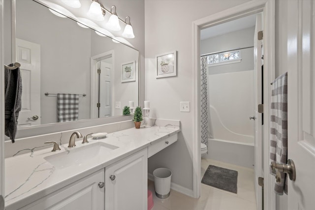 bathroom with toilet, vanity, and shower / tub combo