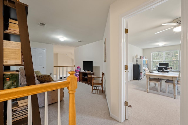 carpeted office with ceiling fan