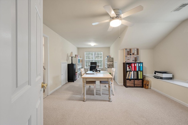 home office with light colored carpet, ceiling fan, baseboards, and lofted ceiling