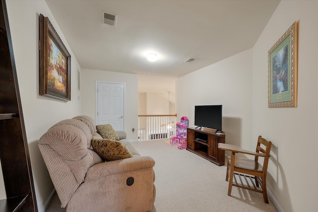 carpeted living room featuring baseboards