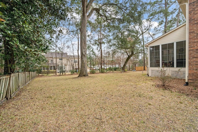 view of yard with a sunroom