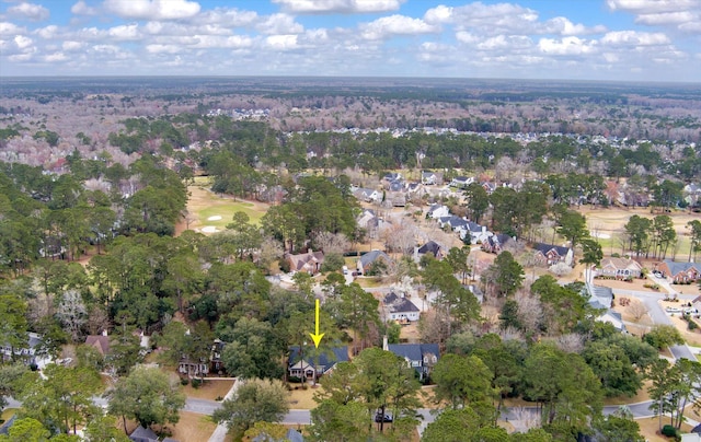 aerial view of property and surrounding area with nearby suburban area