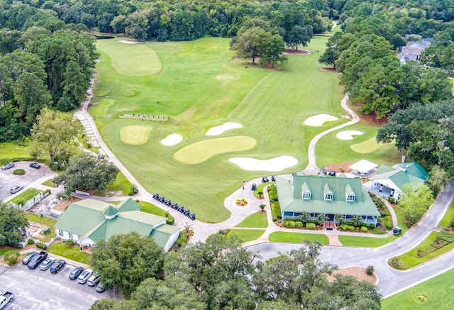 aerial view of property's location featuring a golf course