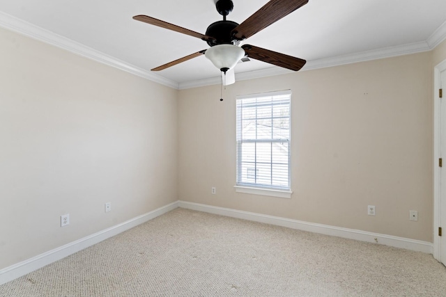 unfurnished room featuring baseboards, crown molding, carpet, and a ceiling fan