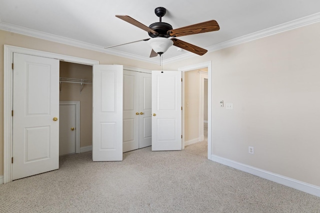 unfurnished bedroom featuring two closets, crown molding, and carpet floors