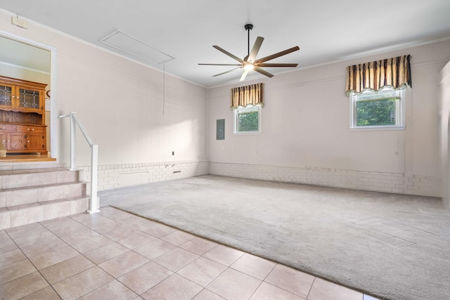 101 Parkside Dr, Goose Creek, SC 29445 - carpeted spare room featuring attic access, electric panel, a ceiling fan, tile patterned flooring, and crown molding
